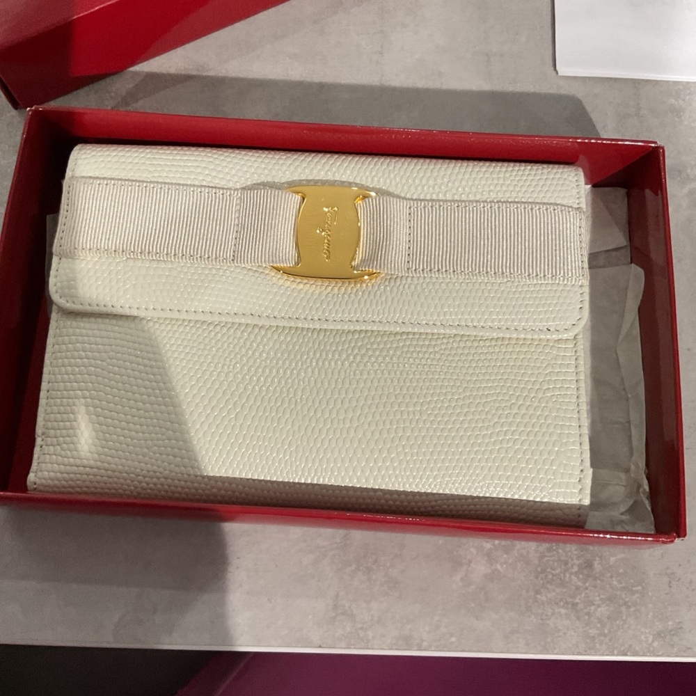 Salvatore Ferragamo Cream Clutch with Gold Buckle
